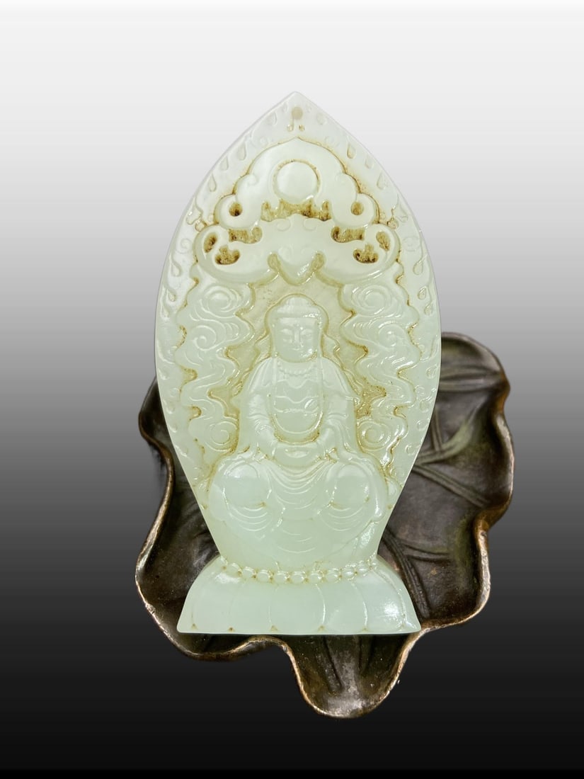 A Exquisite Hotan Jade Avalokitesvara Pendant: A Exquisite Hotan Jade Avalokitesvara Pendant,Ming Dynasty, China,Size:2.9inx1.5inx0.3in,Weight:42g 和田玉观音吊坠,中国明代