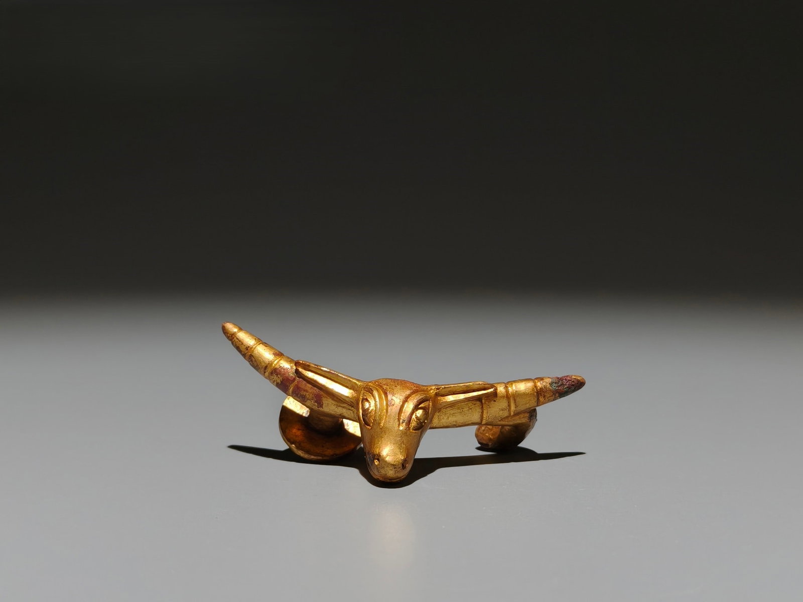 A Exquisite Gilt Bronze Buffalo Head Handheld Carving: A Exquisite Gilt Bronze Buffalo Head Handheld Carving,Han Dynasty, China,Size:2.8inx1in,Weight:g 铜鎏金牛头手把件,中国汉代