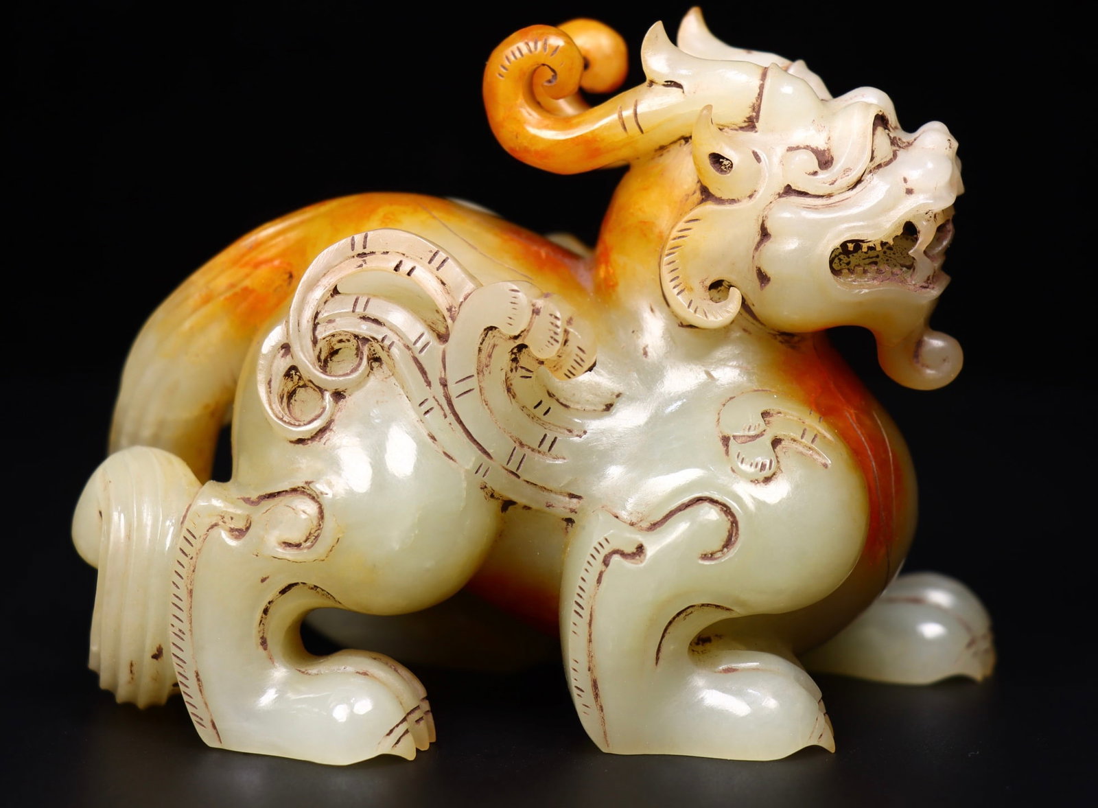 A Exquisite Hotan Jade Auspicious Beast Ornament: A Exquisite Hotan Jade Auspicious Beast Ornament,Han Dynasty, China,Size:4.3inx301.2inx3.5in,Weight:644g 和田玉瑞兽摆件,中国汉代