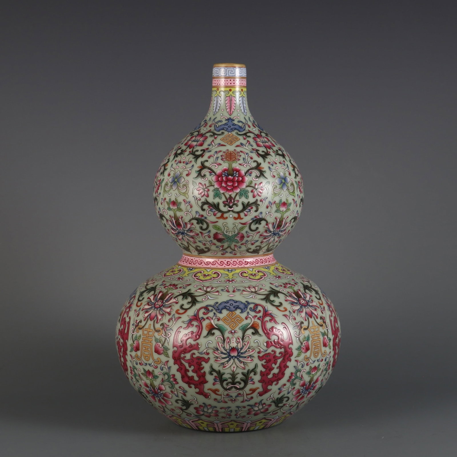 A Exquisite Pea-Green Glaze Famille-Rose Lotus Pattern Gourd Vase: A Exquisite Pea-Green Glaze Famille-Rose Lotus Pattern Gourd Vase,Qing Dynasty, China,Qianlong Six-character Mark,Size:12.4inx7.7inx1.1in