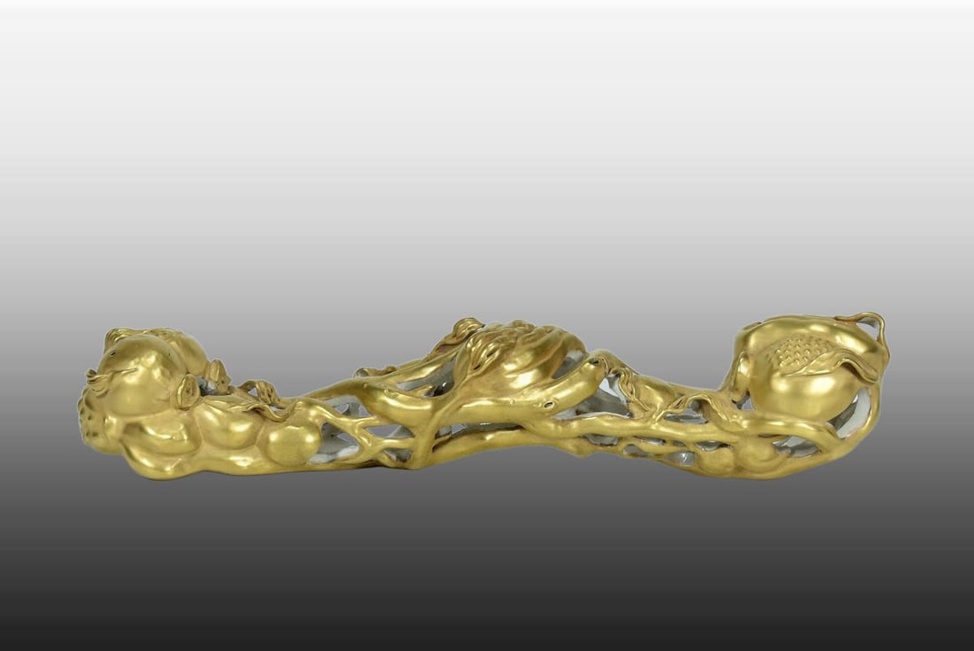 A Exquisite Guan yao Gilt Three Fruit Pattern Ruyi Ornament: A Exquisite Guan yao Gilt Three Fruit Pattern Ruyi Ornament,Qing Dynasty, China,Qianlong Four-character Mark,Size:11.8inx3.1inx2.4in 官窑鎏金三果纹如