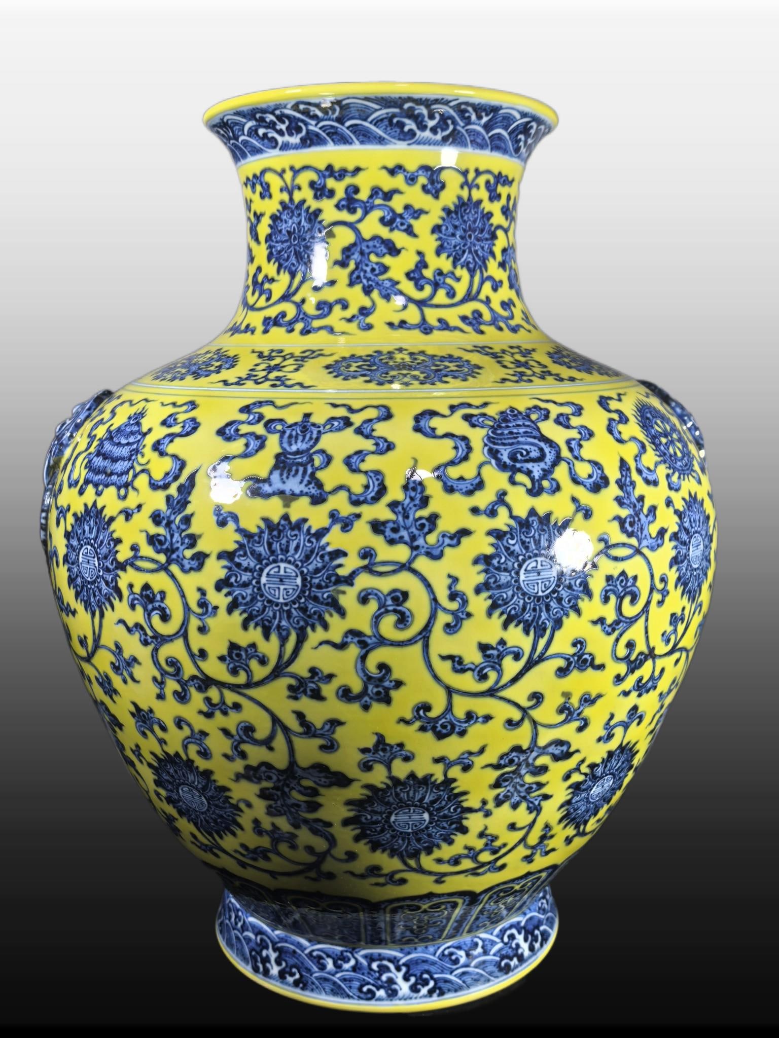 A Exquisite Yellow Ground Blue and White Lotus Eight Treasures Pattern Vase: A Exquisite Yellow Ground Blue and White Lotus Eight Treasures Pattern Vase,Qing Dynasty, China,Qianlong Six-character Mark,Size:18.9inx7.8inx15.4inx8.5in