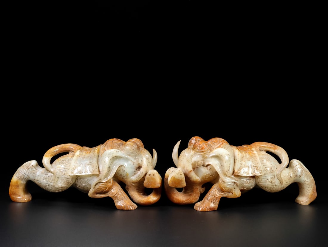 A pair of Exquisite Hotan Jade Elephant Ornament: A pair of Exquisite Hotan Jade Elephant Ornament,Han Dynasty, China,Size:10.2inx4.1inx4.7in,Weight:5387g 一对和田玉象摆件,中国汉ߣ