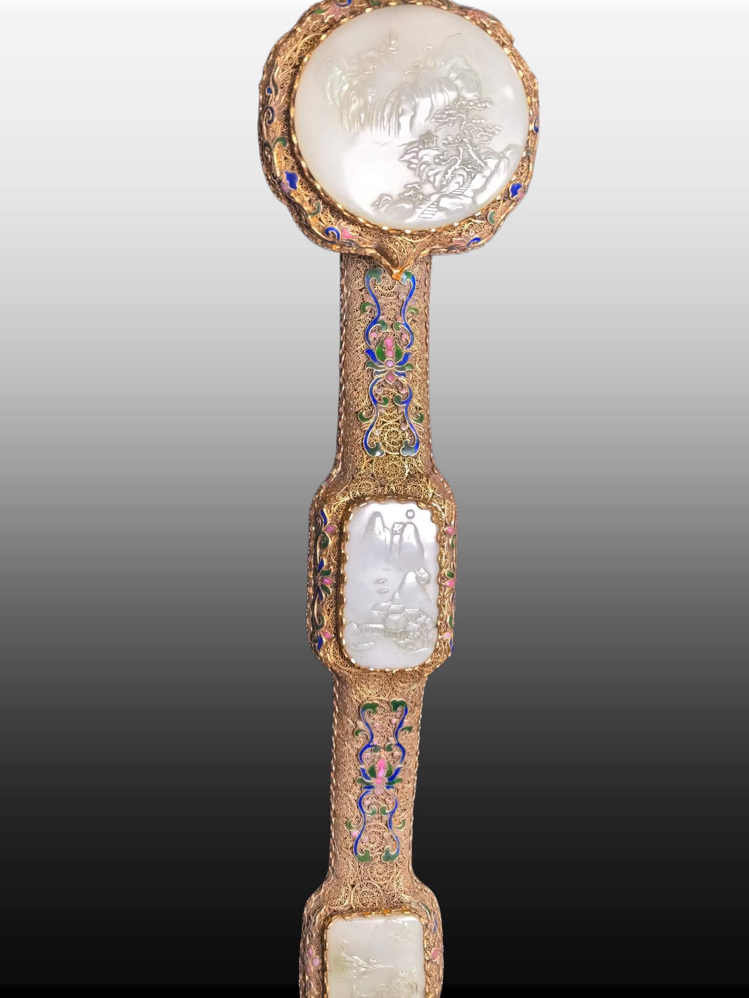 A Exquisite Gilt Bronze Inlaid White Jade Ruyi Ornament: A Exquisite Gilt Bronze Inlaid White Jade Ruyi Ornament,Qing Dynasty, China,Qianlong Four-character Mark,Size:9.8inx4.3inx3.3in,Weight:926g