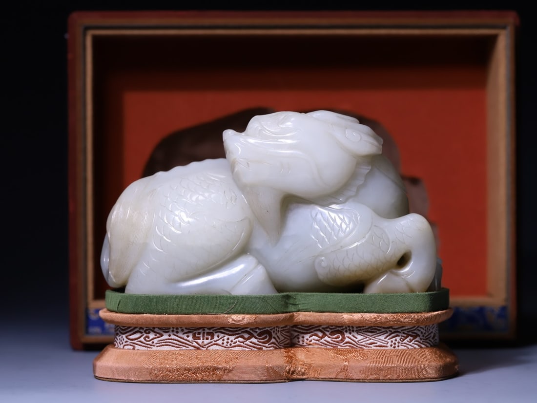 A Exquisite Hotan Jade Auspicious Beast Ornament: A Exquisite Hotan Jade Auspicious Beast Ornament,Qing Dynasty, China,Size:3.4inx6.1inx3in,Weight:1431g 和田玉瑞兽摆件,中国清代