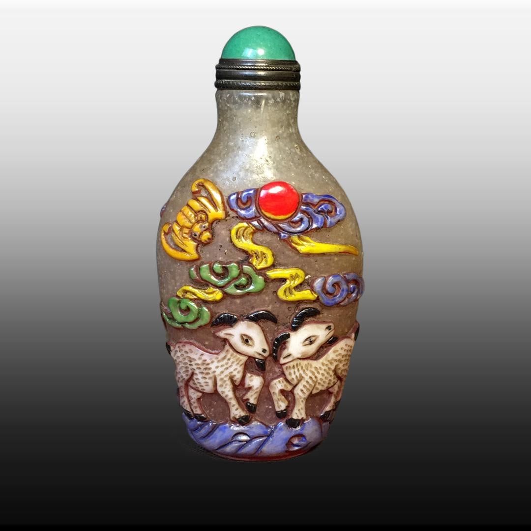 A Exquisite Colored glaze Sheep Pattern Snuff Bottle: A Exquisite Colored glaze Sheep Pattern Snuff Bottle,Qing Dynasty, China,Size:1.6inx1.2in ,Weight:80g 琉璃羊纹鼻烟壶,中国清代