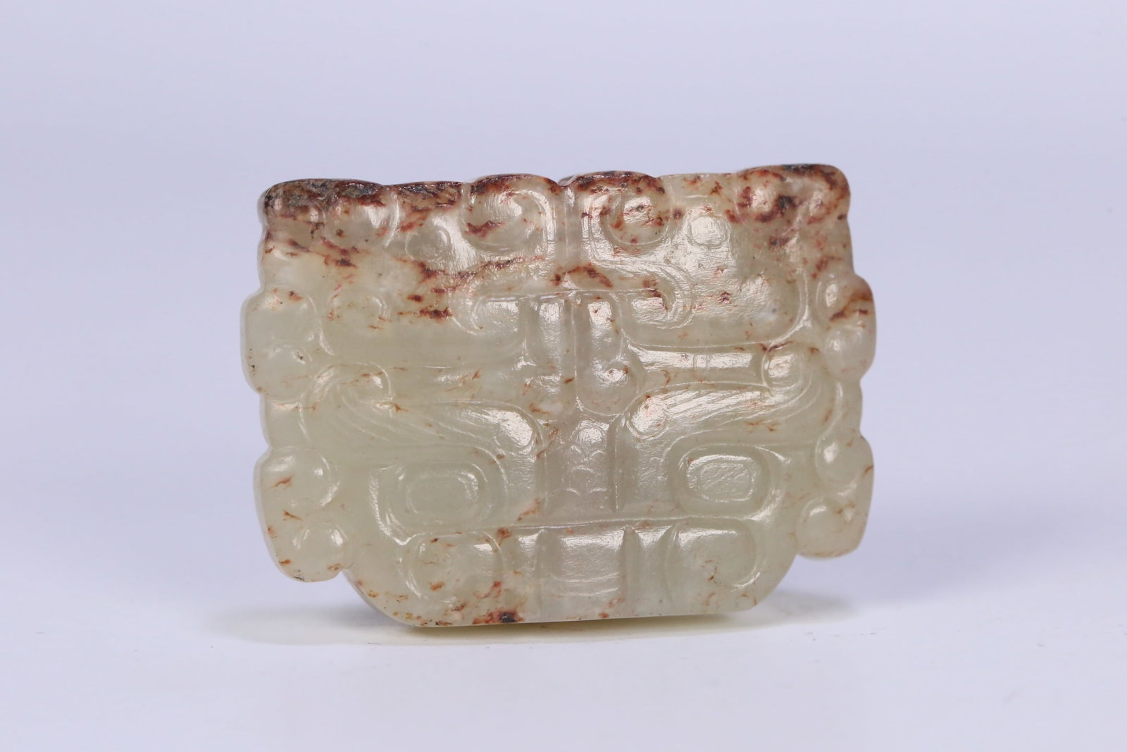 A Exquisite Hotan Jade Beast-Face Pattern Ornament: A Exquisite Hotan Jade Beast-Face Pattern Ornament,Han Dynasty, China,Size:1.8inx1.3inx0.4in 和田玉兽面纹饰件,中国汉代