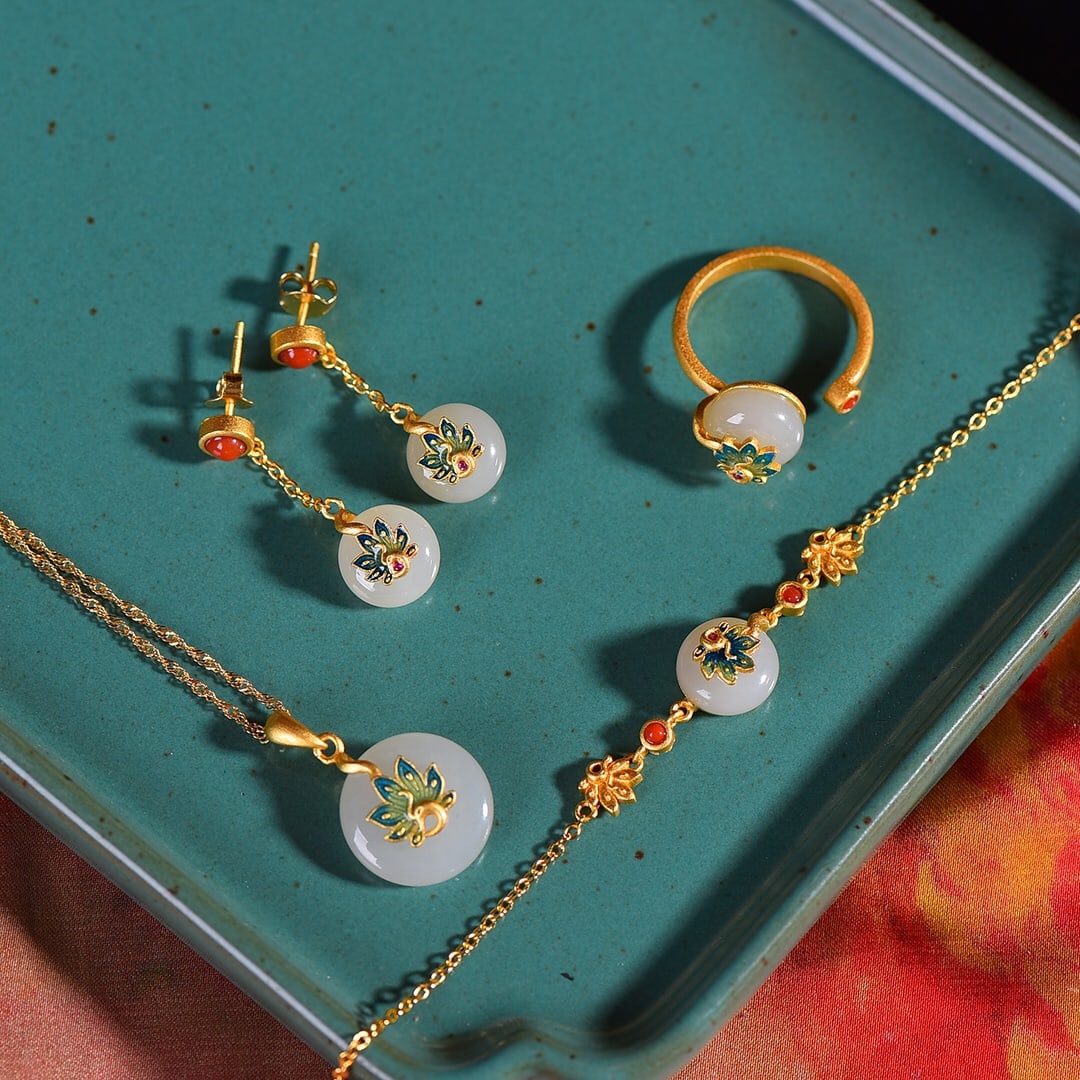 A Set of Exquisite Silver-Inlaid Hotan Jade Jewelry: A Set of Exquisite Silver-Inlaid Hotan Jade Jewelry,Size:0.6inx0.6in(pendant) 0.4inx0.4in(earrings) 0.4inx0.4in(ring) 4.3inx0.4in(bracelet, presumed typo for 1x0.4in) 一套银镶&