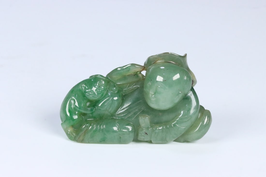 An Exquisite Jadeite Figure Hand Piece: An Exquisite Jadeite Figure Hand Piece Qing Dynasty, China Size:2.1inx1.3inx0.8in Weight:45g翡翠童子戏兽把件 中国清代 Size:5.25c