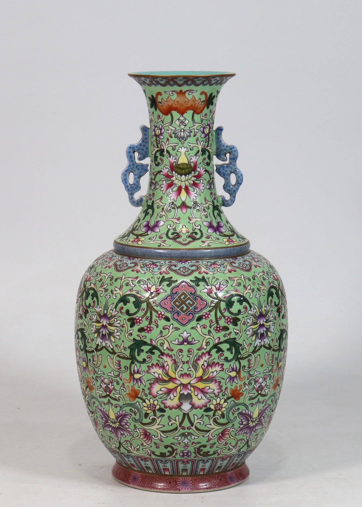 An Exquisite Green Ground Lotus Pattern Double-Ears Vase: An Exquisite Green Ground Lotus Pattern Double-Ears Vase Qing Dynasty, China Qianlong Six-character Mark Size:13.3inx6.5in绿底缠枝花卉双耳瓶