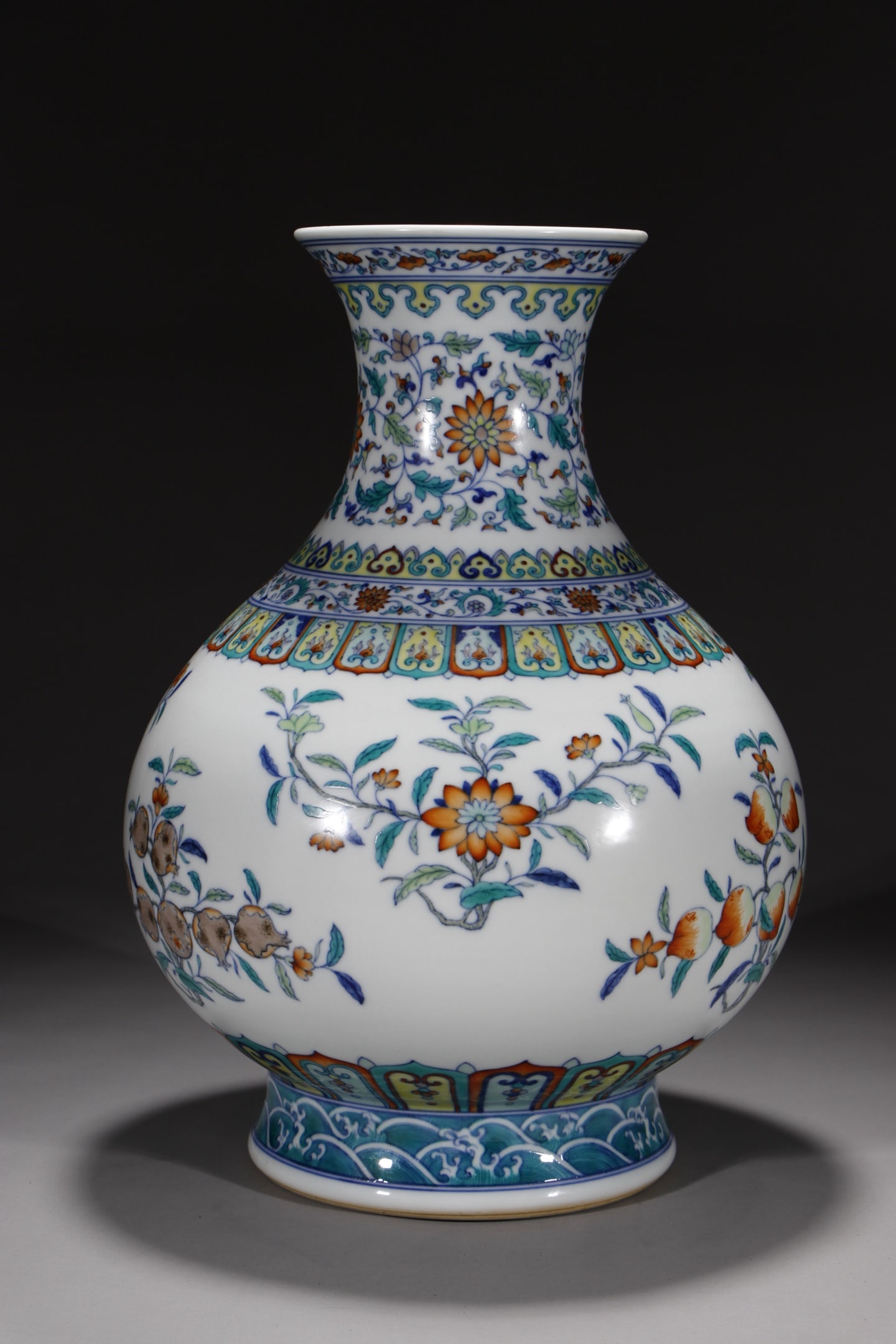 An Exquisite Doucai Lotus Pattern Flower and Fruit Pattern Seawater Pattern Vase: An Exquisite Doucai Lotus Pattern Flower and Fruit Pattern Seawater Pattern Vase Qing Dynasty, China Qianlong Six-character Mark