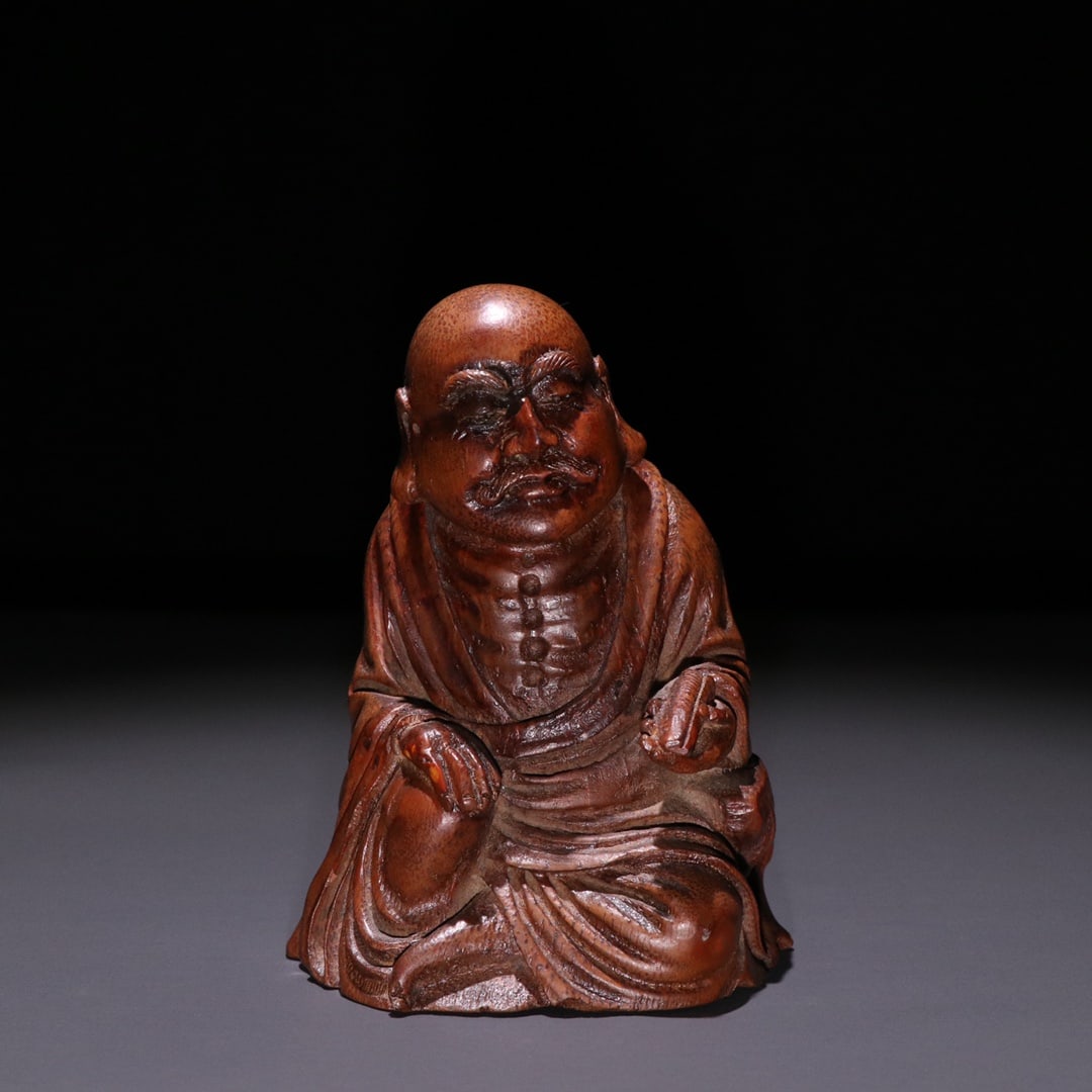 An Exquisite Bamboo Statue of Arhat Ornament: An Exquisite Bamboo Statue of Arhat Ornament Qing Dynasty, China Size:3.5inx2.5in Weight:74g竹雕罗摆件 中国清代 Size:9cmx6.3cm Weight:74g