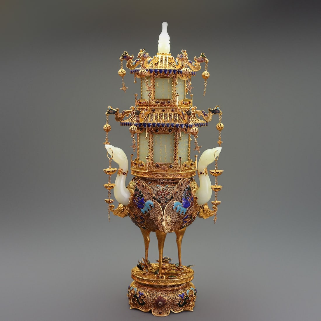 An Exquisite Gilt Bronze Inlaid White Jade Ornament: An Exquisite Gilt Bronze Inlaid White Jade Ornament Qing Dynasty, China Qianlong Four-character Mark Size:18.9inx8.7in Weight:2424g Size:22.4inx10.6inx11.2in