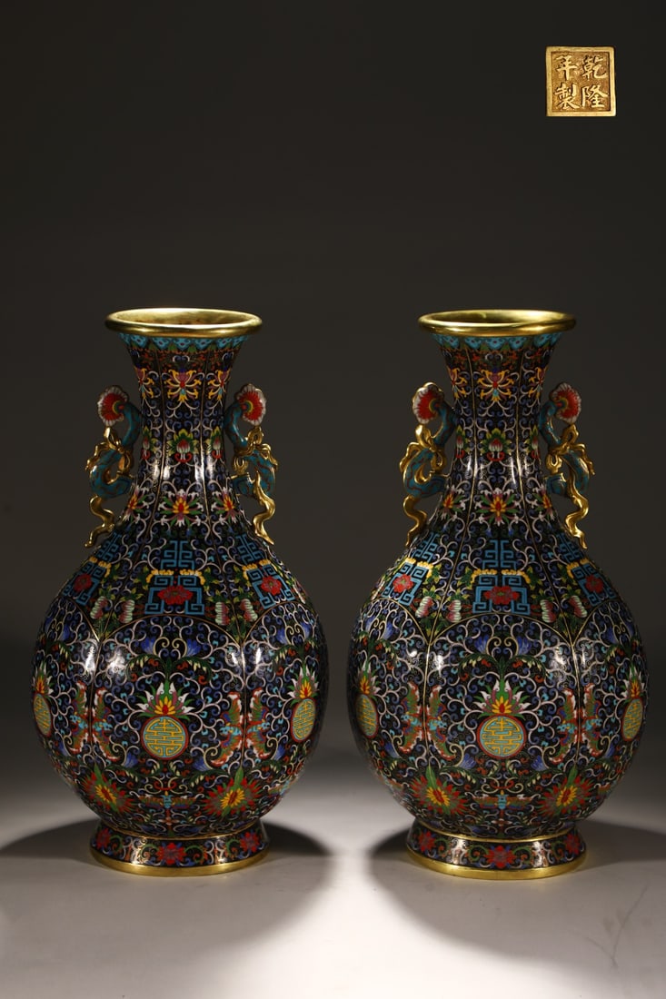 A Pair of Exquisite Cloisonne Lotus Pattern Bats and Peach Pattern Double-Ears Vase: A Pair of Exquisite Cloisonne Lotus Pattern Bats and Peach Pattern Double-Ears Vase Qing Dynasty, China Qianlong Four-character Mark Size:20.5inx10.2in Weight:13.1kg景泰蓝缠
