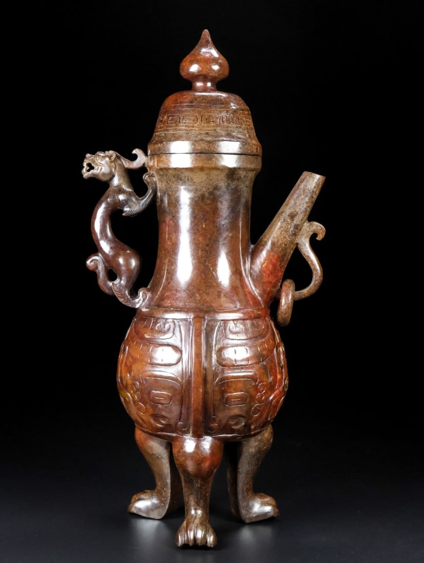 An Exquisite White Jade Beast-Face Pattern Ewer: An Exquisite White Jade Beast-Face Pattern Ewer Han Dynasty, China Size:10.8inx5.2inx3.4in Weight:1.25kg白玉兽面纹执壶 中国汉代