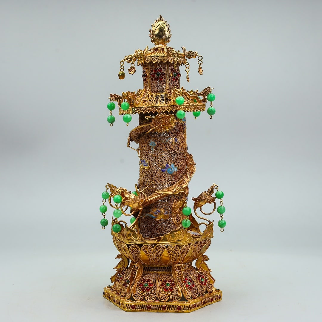 An Exquisite Gilt Bronze Inlaid Gems Dragon Pattern Pagoda: An Exquisite Gilt Bronze Inlaid Gems Dragon Pattern Pagoda Qing Dynasty, China Qianlong Four-character Mark Size:13.4inx5.5in Weight:949g铜鎏金双龙盘塔柱