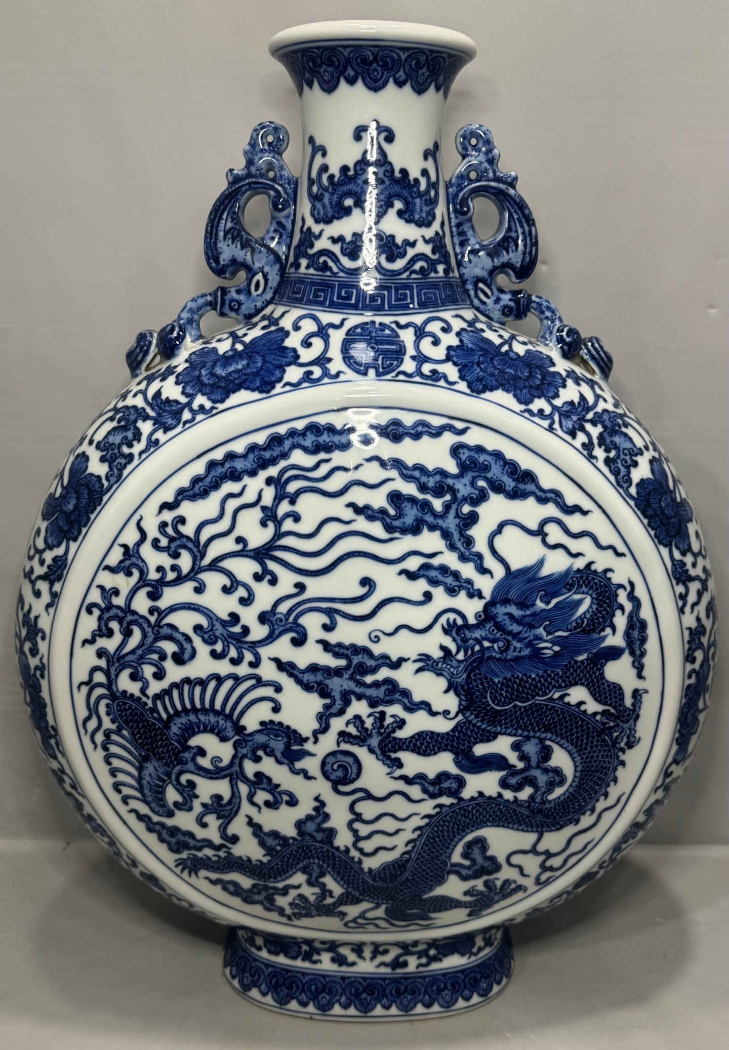 An Exquisite Blue and White Dragon and Phoenix Pattern Bats and Peach Pattern Double-Ears Vase: An Exquisite Blue and White Dragon and Phoenix Pattern Bats and Peach Pattern Double-Ears Vase Qing Dynasty, China Qianlong Six-character Mark