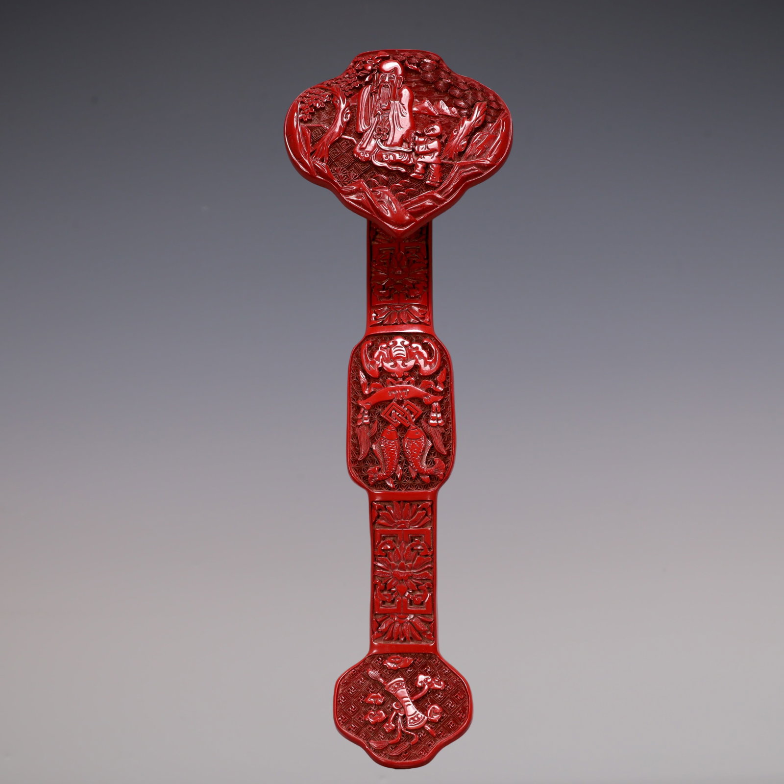 A Exquisite Carved Red Lacquer Character and Story Pattern Bats and Peach Pattern Ruyi: A Exquisite Carved Red Lacquer Character and Story Pattern Bats and Peach Pattern Ruyi Qing Dynasty, China Size:13.4inx4.3inx2.4in