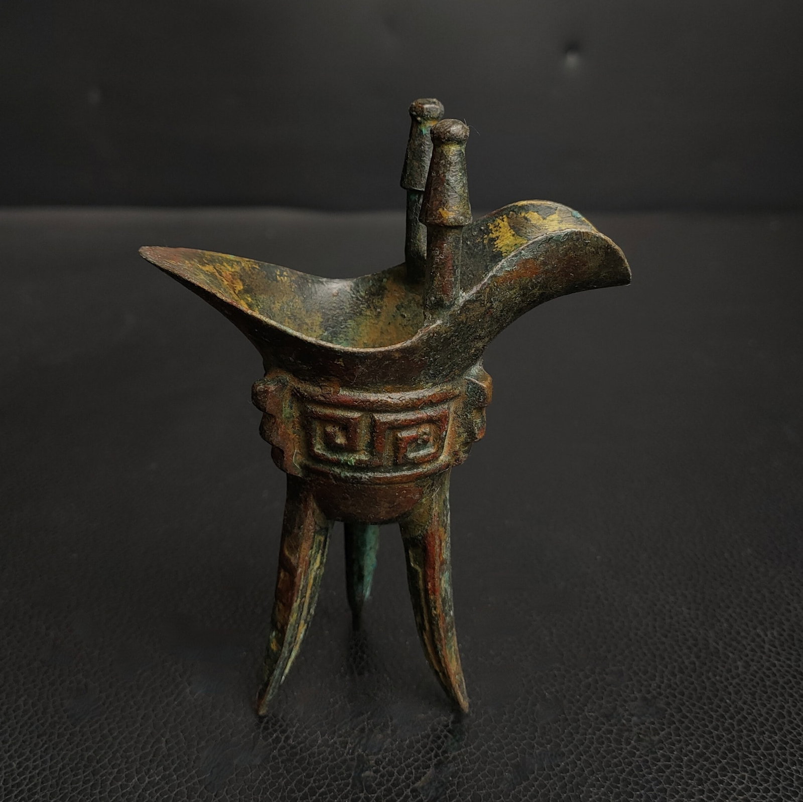 An Exquisite Bronze Goblet: An Exquisite Bronze Goblet N.Zhou , China Size:4.3inx3.1in Weight:0.2kg青铜爵 西周时期 Size:11cmx8cm Weight:0.2kg