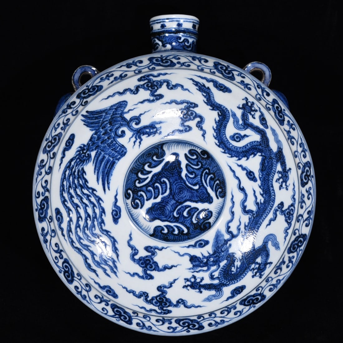 An Exquisite Blue and White Dragon and Phoenix Pattern Lotus Pattern Vase: An Exquisite Blue and White Dragon and Phoenix Pattern Lotus Pattern Vase Ming Dynasty, China Size:5.3inx11.8in青花龙凤纹卧壶