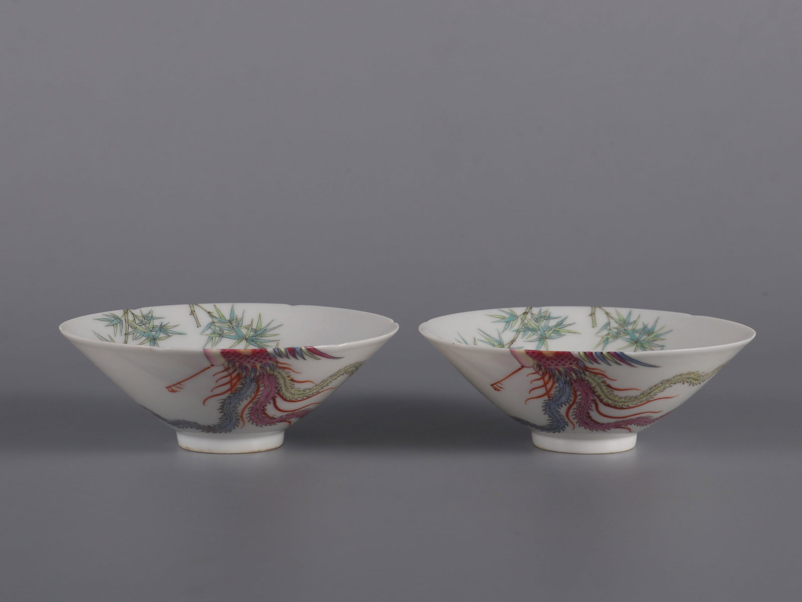 A Pair of Exquisite Famille-Rose Phoenix Pattern Bamboo Pattern Cup: A Pair of Exquisite Famille-Rose Phoenix Pattern Bamboo Pattern Cup Qing Dynasty, China Size:1.3inx3.5in粉彩过墙凤纹斗笠杯一对