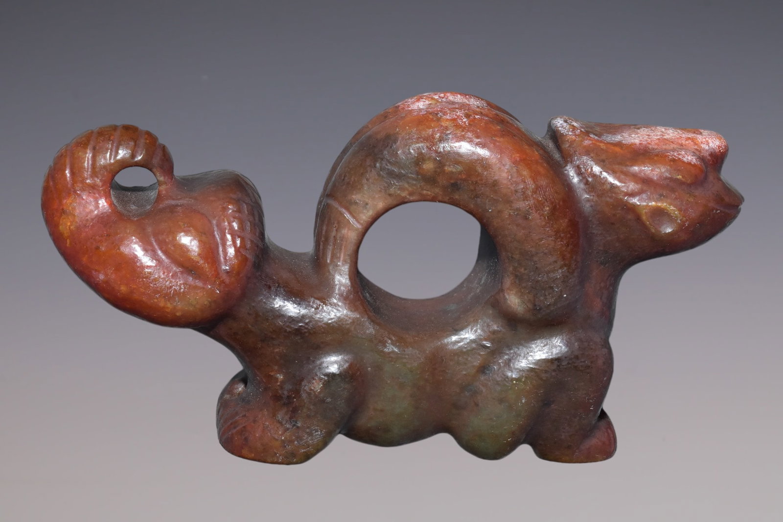 An Exquisite Hemo Jade Dragon Ornament: An Exquisite Hemo Jade Dragon Ornament Hong Shan Culture Size:4.3inx6.3in Weight:1.04kg河磨玉变形摆件 红山文化 Size:11cmx16cm