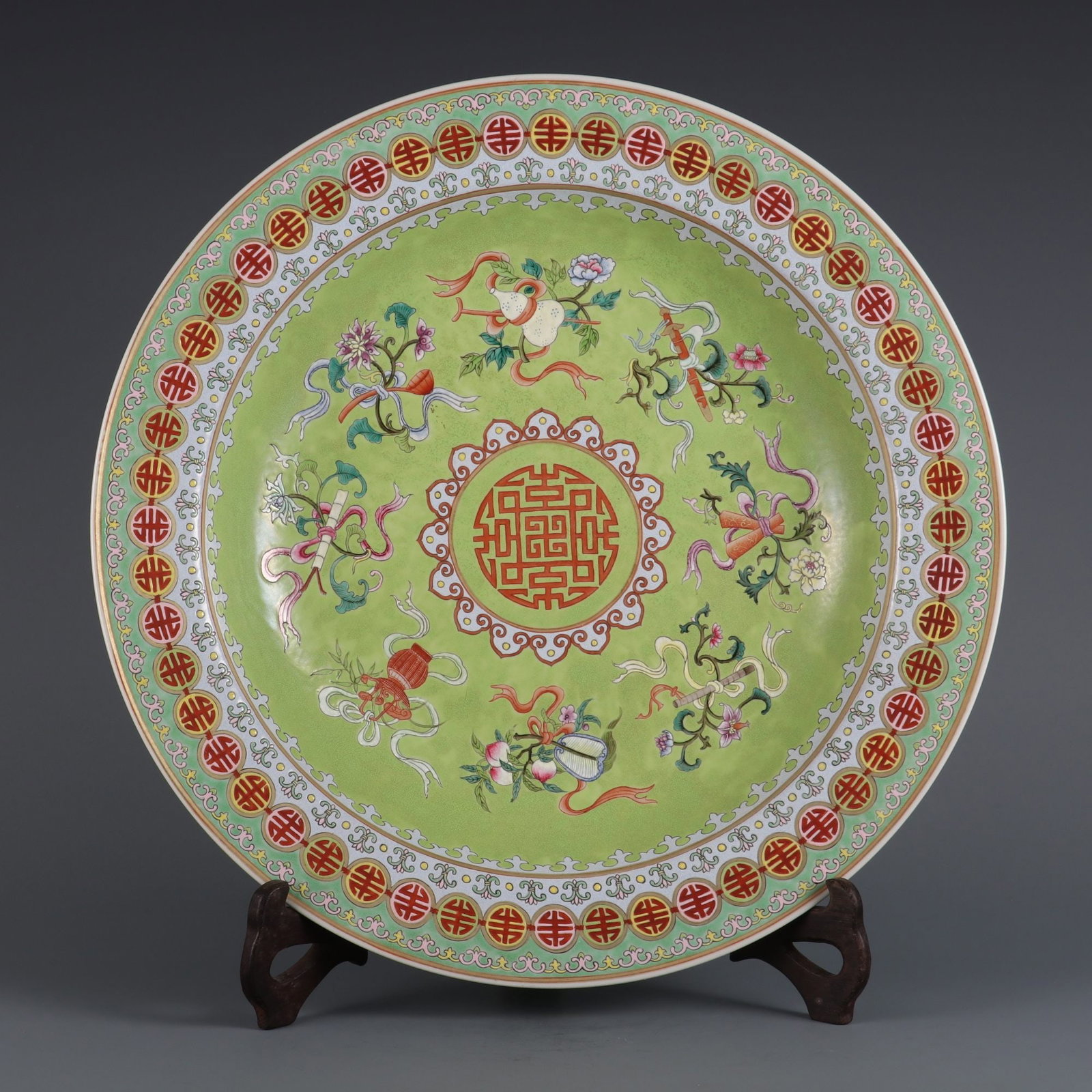 An Exquisite Famille-Rose Green Ground Eight Treasures Pattern Plate: An Exquisite Famille-Rose Green Ground Eight Treasures Pattern Plate Qing Dynasty, China Qianlong Six-character Mark