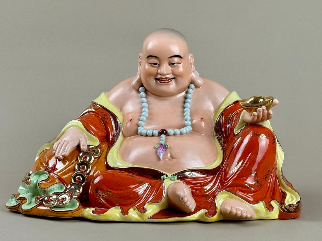 An Exquisite Iron-Red Painted Gold Statue of Arhat: An Exquisite Iron-Red Painted Gold Statue of Arhat the Republic of China Size:7.9inx12.6in矾红描金布袋罗汉 民国 Size:20cmx32cm