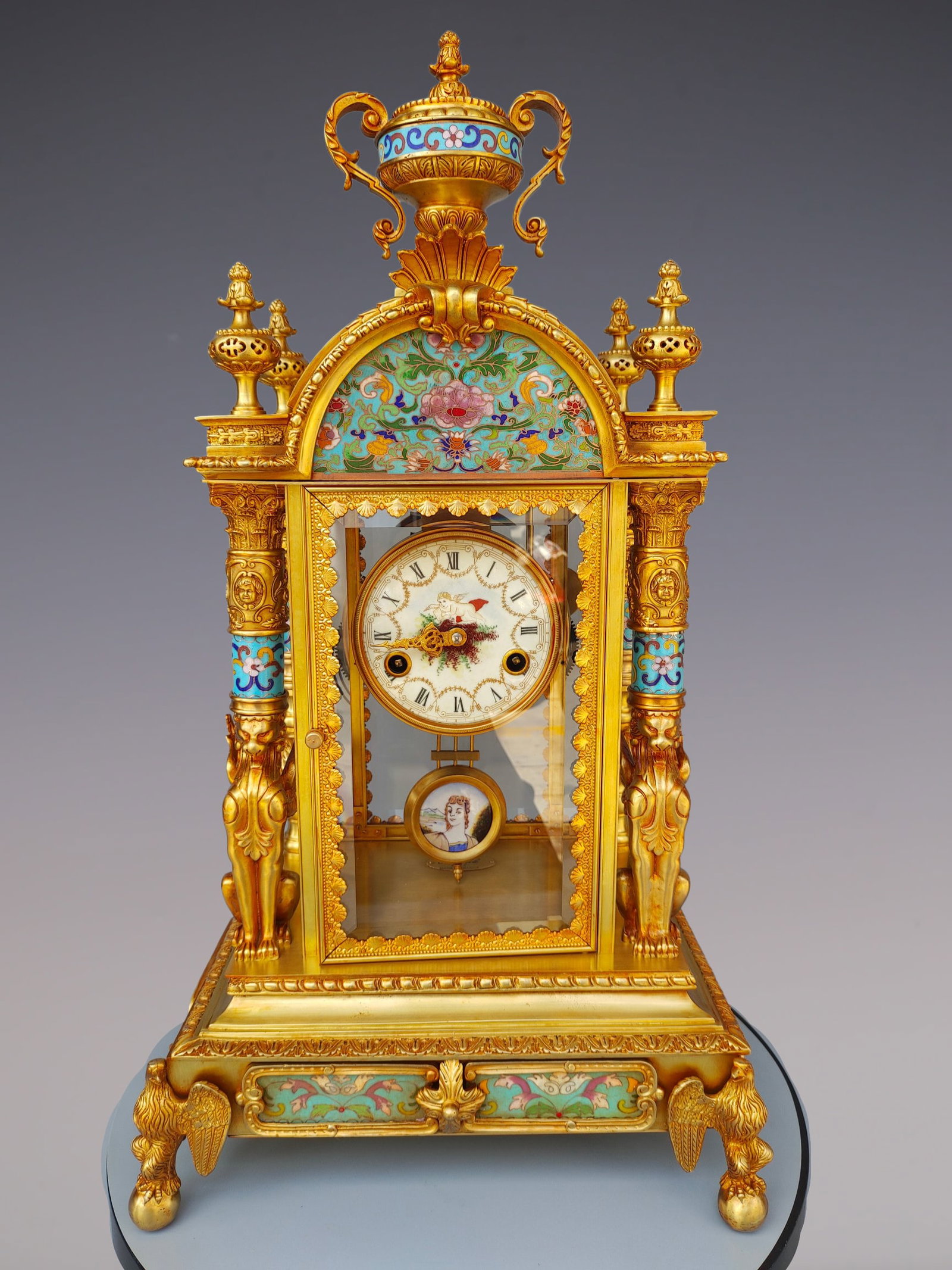 An Exquisite Gilt Bronze Lotus Pattern Clock: An Exquisite Gilt Bronze Lotus Pattern Clock Size:14.2inx10.2inx26in铜鎏金缠枝莲纹钟表 Size:36cmx26cmx66cm