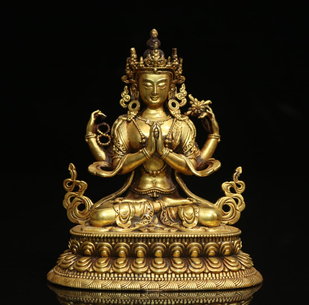 An Exquisite Gilt Bronze Four-arms Statue of Avalokitesvara Ornament: An Exquisite Gilt Bronze Four-arms Statue of Avalokitesvara Ornament Ming Dynasty, China Size:3.9inx3.1in Weight:471g铜鎏金四臂观音摆件