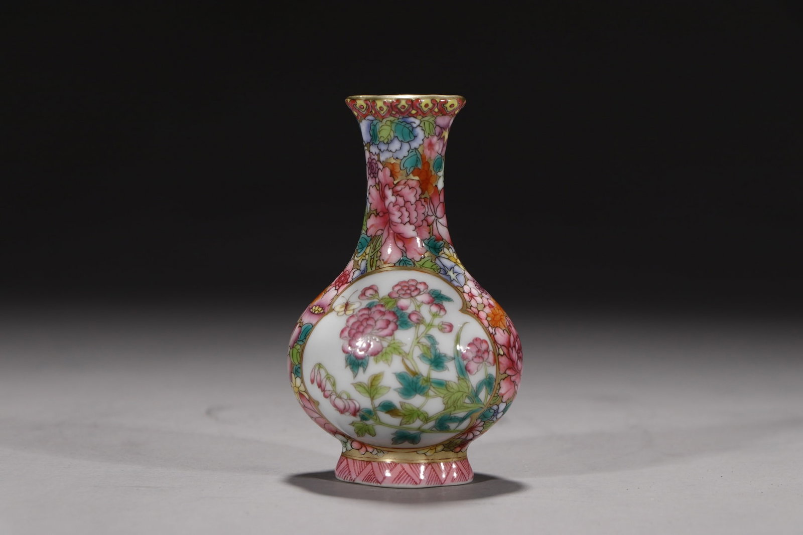 An Exquisite Famille-Rose Painted Gold Flower and Bird Pattern Vase: An Exquisite Famille-Rose Painted Gold Flower and Bird Pattern Vase Qing Dynasty, China Yongzheng Four-character Mark Size:3.5in粉彩万花描金开窗瓶
