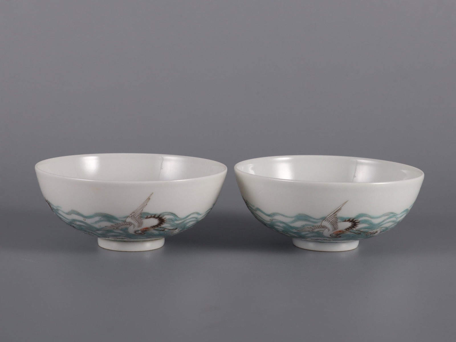 A Pair of Exquisite Famille-Rose Seawater Pattern Crane Pattern Cup: A Pair of Exquisite Famille-Rose Seawater Pattern Crane Pattern Cup Qing Dynasty, China Yongzheng Six-character Mark Size:1.7inx3.7in粉彩海水仙鹤纹杯
