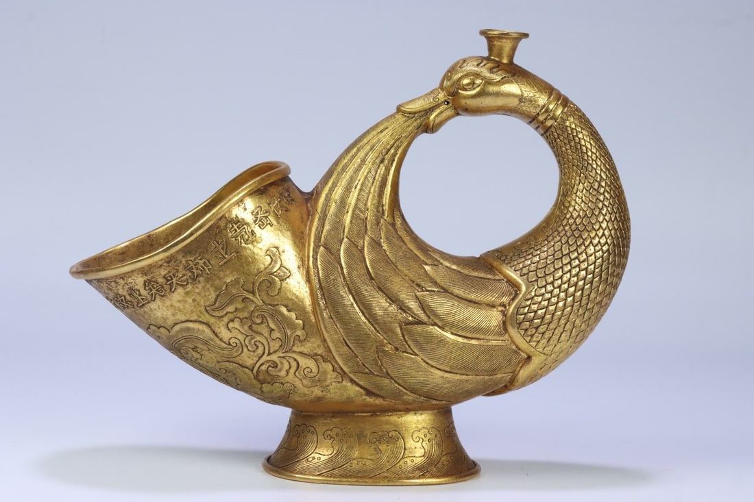 An Exquisite Gilt Bronze Phoenix Pattern Ewer: An Exquisite Gilt Bronze Phoenix Pattern Ewer Liao Dynasty, China Size:10.2inx4inx8.1in Weight:816g铜鎏金凤纹酒具 中国辽代