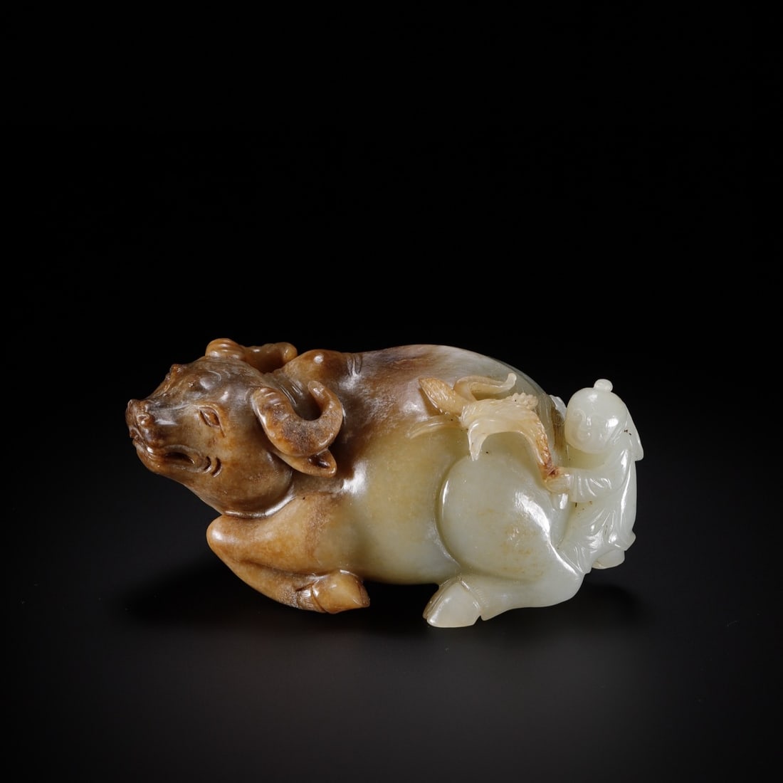 An Exquisite White Jade Buffalo Ornament: An Exquisite White Jade Buffalo Ornament Qing Dynasty, China Size:4.3inx2.2inx1.7in Weight:421.5g白玉童子戏牛 中国清代 Size:11cmx5.5cmx4.3cm
