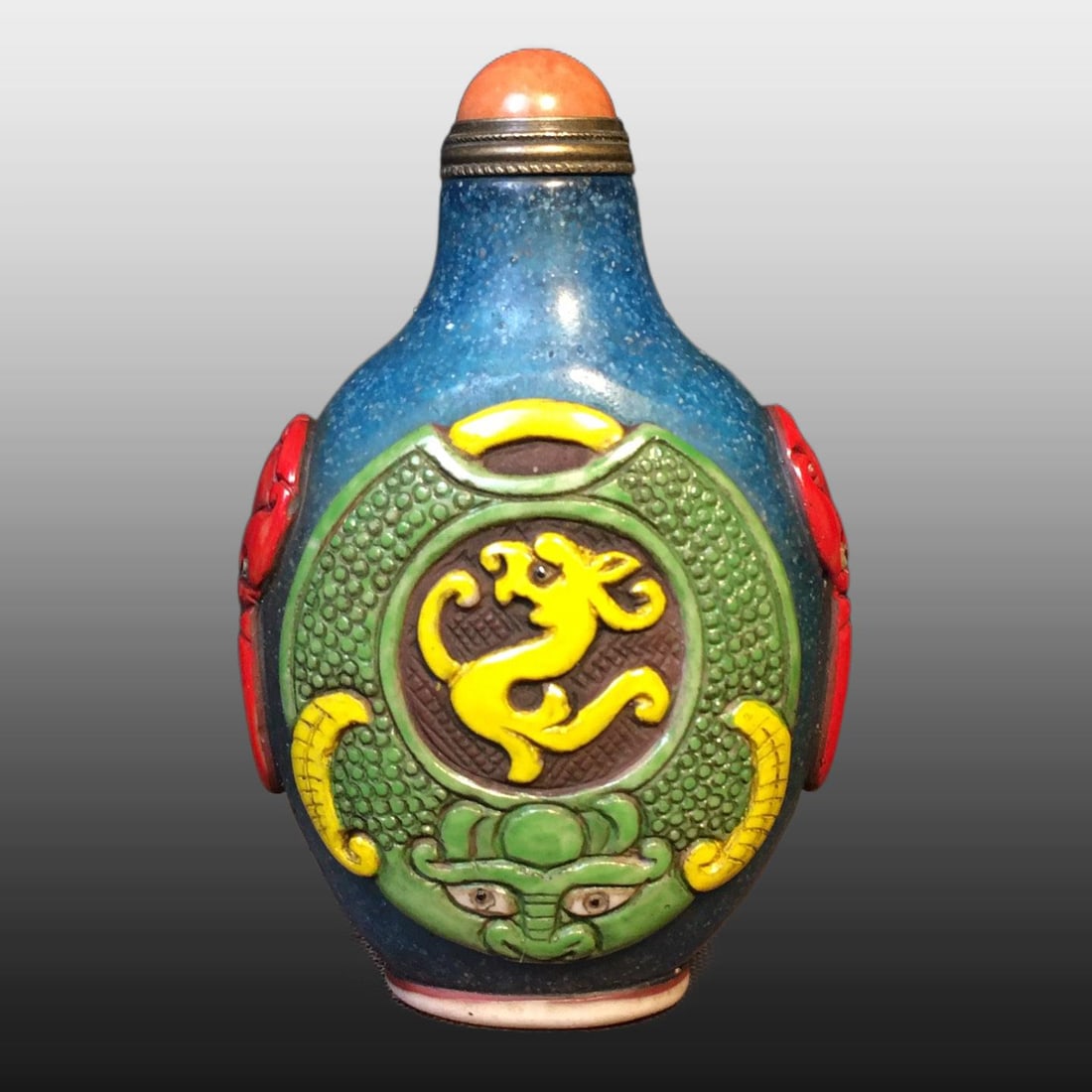 A Exquisite Colored glaze Beast-Face Pattern Snuff Bottle: A Exquisite Colored glaze Beast-Face Pattern Snuff Bottle,Qing Dynasty, China,Size:2inx1.2in ,Weight:90g
