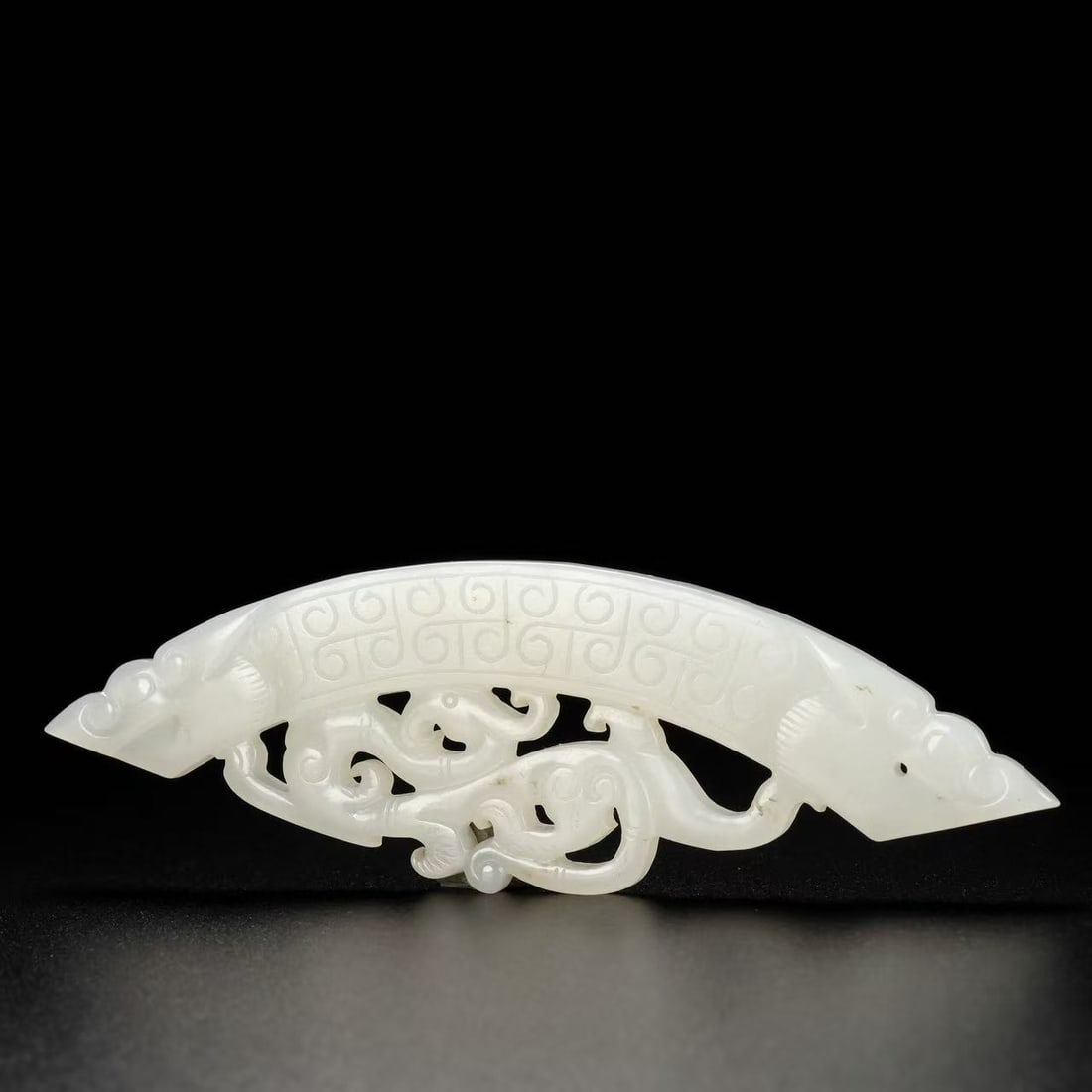 A Exquisite Hotan Jade Phoenix Pattern Bi: A Exquisite Hotan Jade Phoenix Pattern Bi,Qing Dynasty, China,Size:4.3inx0.2inx1.4in,Weight:28g 和田玉凤纹璧,中国清代
