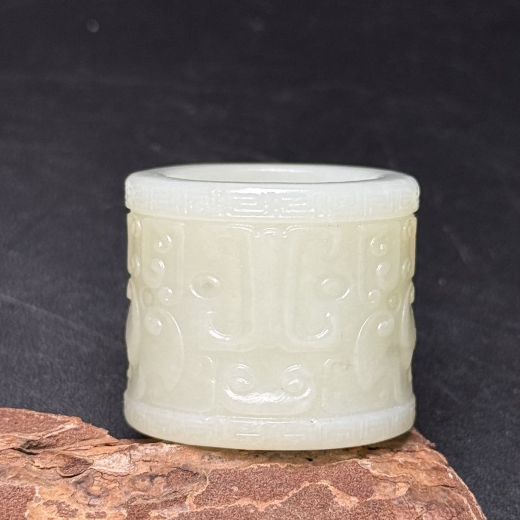 A Exquisite Hotan Jade Ruyi Pattern Thumb Ring: A Exquisite Hotan Jade Ruyi Pattern Thumb Ring,Qing Dynasty, China,Size:0.9inx1.2in,Weight:26g 和田玉如意纹扳指,中国清代