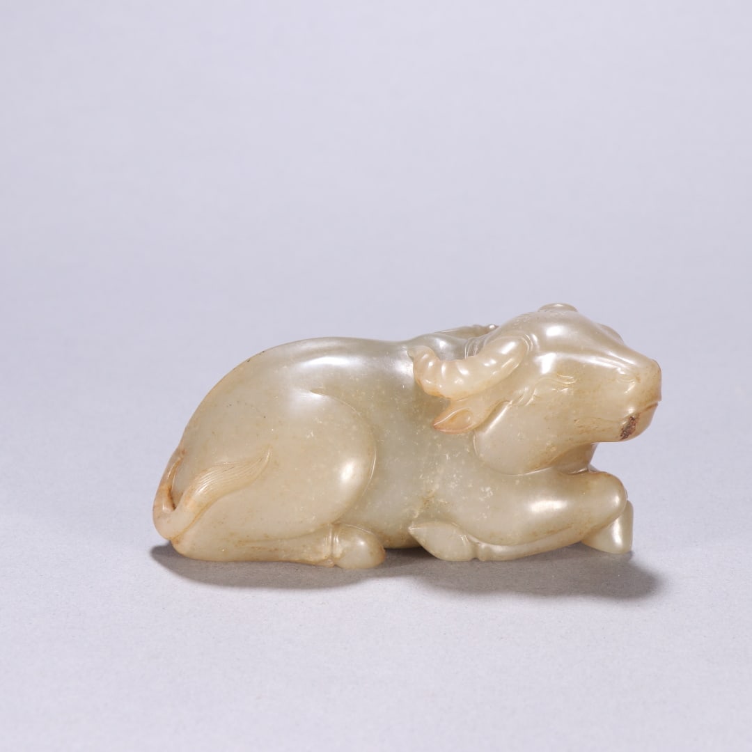 A Exquisite Hotan Jade Buffalo Ornament: A Exquisite Hotan Jade Buffalo Ornament,Qing Dynasty, China,Size:1.8inx3.9in 和田玉牛摆件,中国清代