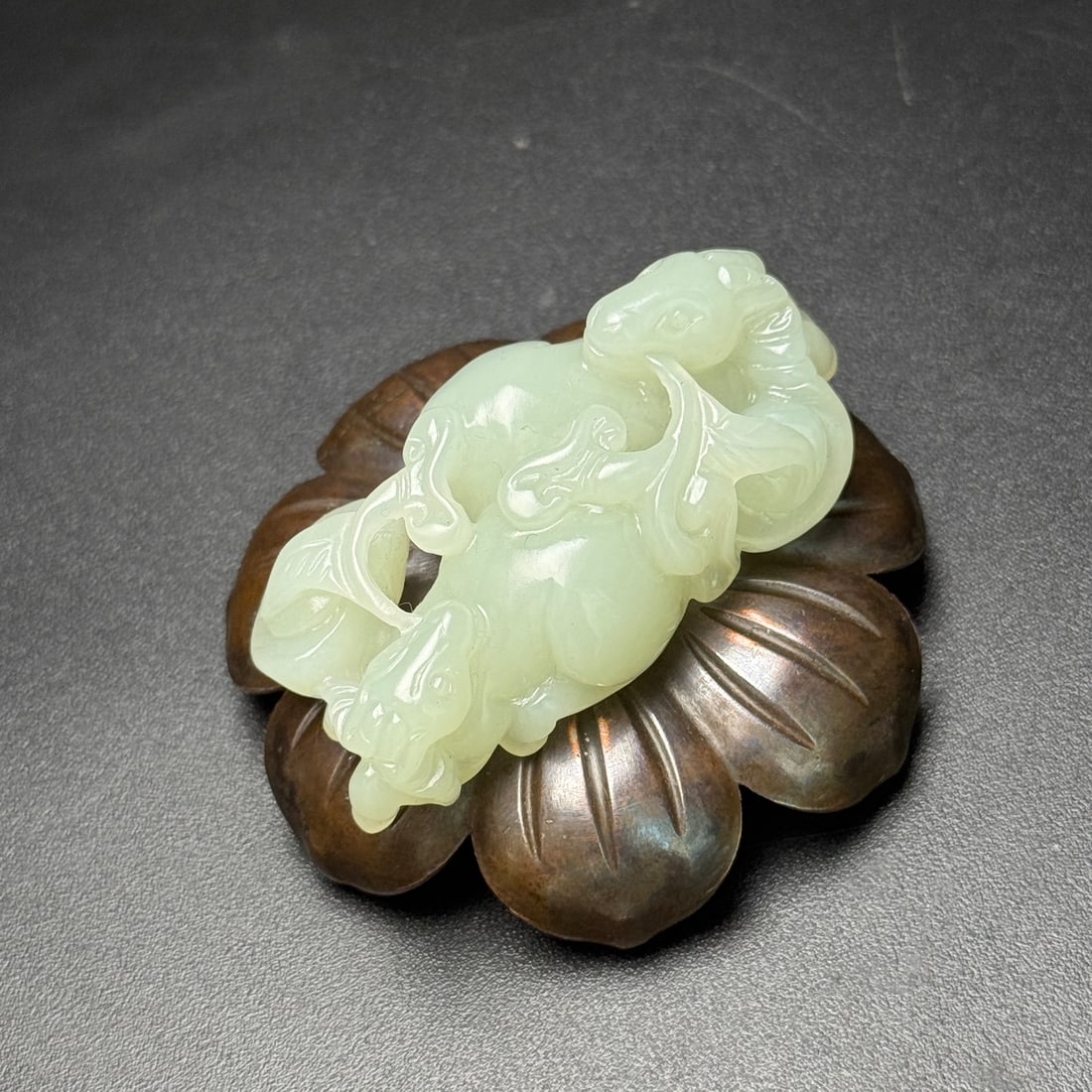 A Exquisite Hotan Jade Sheep Ornament: A Exquisite Hotan Jade Sheep Ornament,Qing Dynasty, China,Size:2.2inx1.2inx0.7in,Weight:36g 和田玉羊形摆件,中国清代