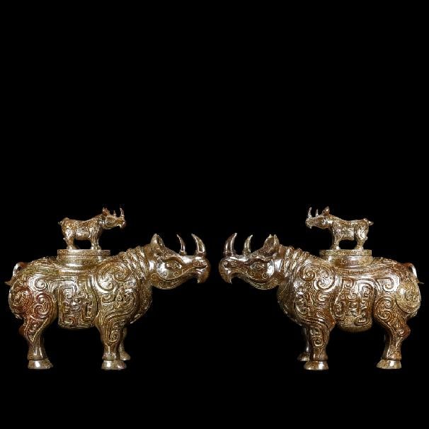 A pair of Exquisite Hotan Jade Rhinoceros Ornament: A pair of Exquisite Hotan Jade Rhinoceros Ornament,Han Dynasty, China,Size:13.8inx5.1inx10.2in,Weight:10433g