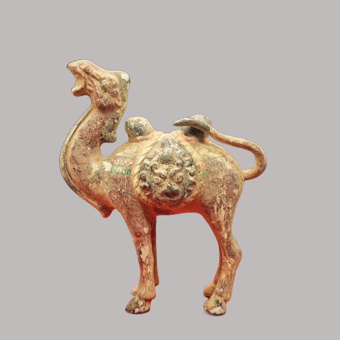 A Exquisite Coppery Painted Color Camel Ornament: A Exquisite Coppery Painted Color Camel Ornament,Tang Dynasty, China,Size:3.3inx4.3in,Weight:258g 铜彩绘骆驼摆件,中国唐代