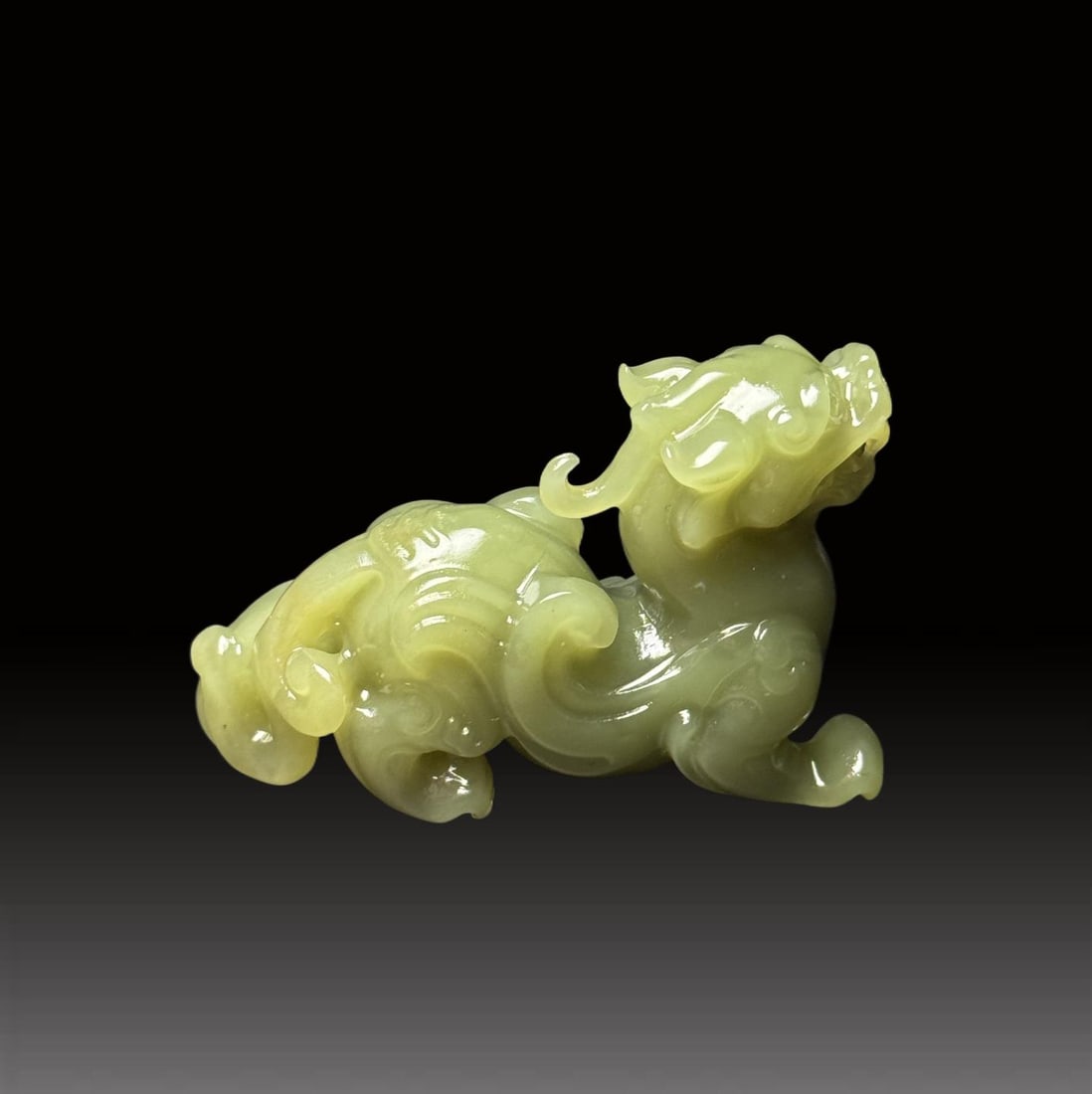 A Exquisite Hotan Yellow Jade Auspicious Beast Ornament: A Exquisite Hotan Yellow Jade Auspicious Beast Ornament,Qing Dynasty, China,Size:2.2inx0.8inx1.6in,Weight:54g
