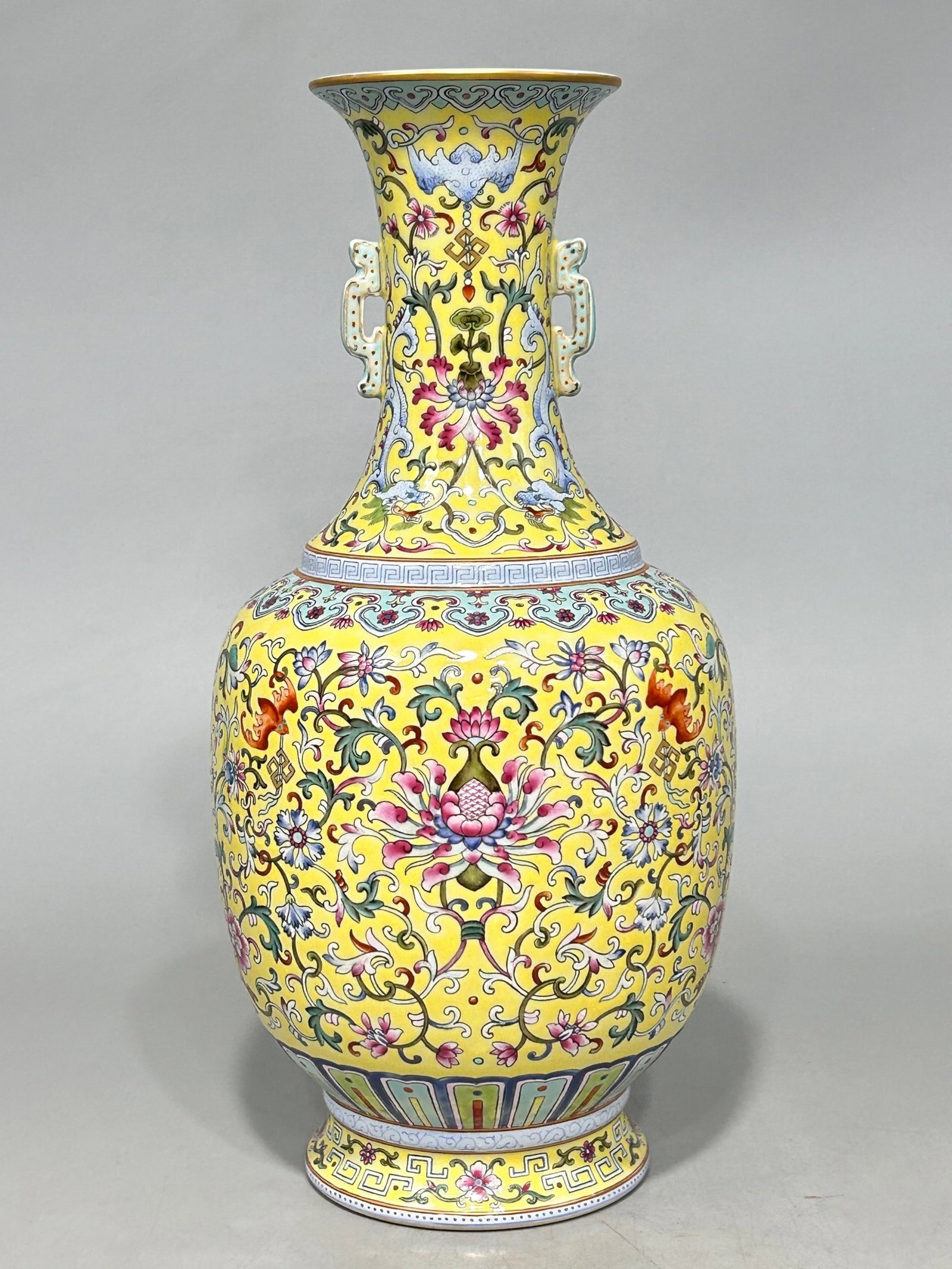A Rare Famille-Rose Yellow Ground Bats and Peach Pattern Double-Ears Vase: A Rare Famille-Rose Yellow Ground Bats and Peach Pattern Double-Ears Vase,Qing Dynasty,China,Qianlong Six-character Mark,Size:13.6inx6.5in