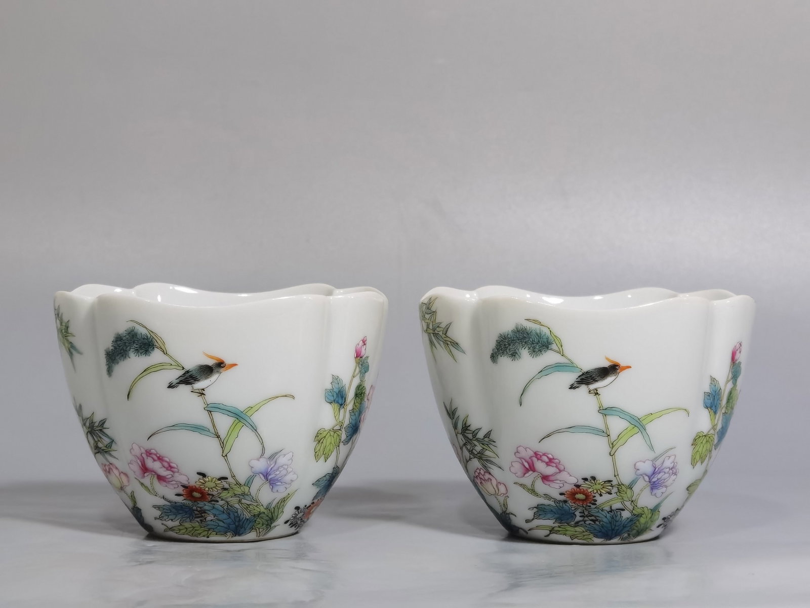 A Pair of Exquisite Famille-Rose Flower and Bird Pattern Cups: A Pair of Exquisite Famille-Rose Flower and Bird Pattern Cups,Qing Dynasty,China,Qianlong Four-character Mark,Size:3inx2.2in 一对粉彩花鸟纹杯子,&#
