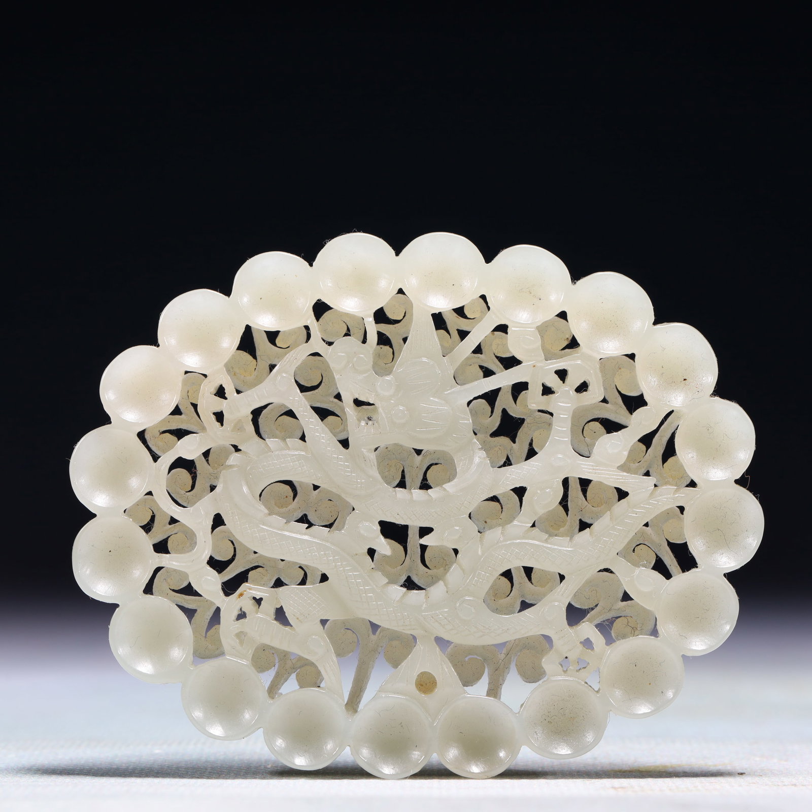 An Exquisite White Jade Dragon Pattern Pendant: An Exquisite White Jade Dragon Pattern Pendant,Qing Dynasty,China,Size:3.3inx2.6in,Weight:63.4g 白玉龙纹佩,中国清代