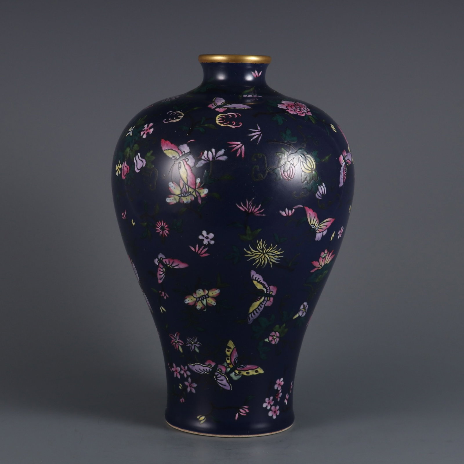 An Exquisite Ji Blue Glazed Famille-Rose Flower and Butterfly Pattern Vase: An Exquisite Ji Blue Glazed Famille-Rose Flower and Butterfly Pattern Vase,Qing Dynasty,China,Qianlong Six-character Mark,Size:11.3inx7.4in 霁蓝釉粉彩花卉"