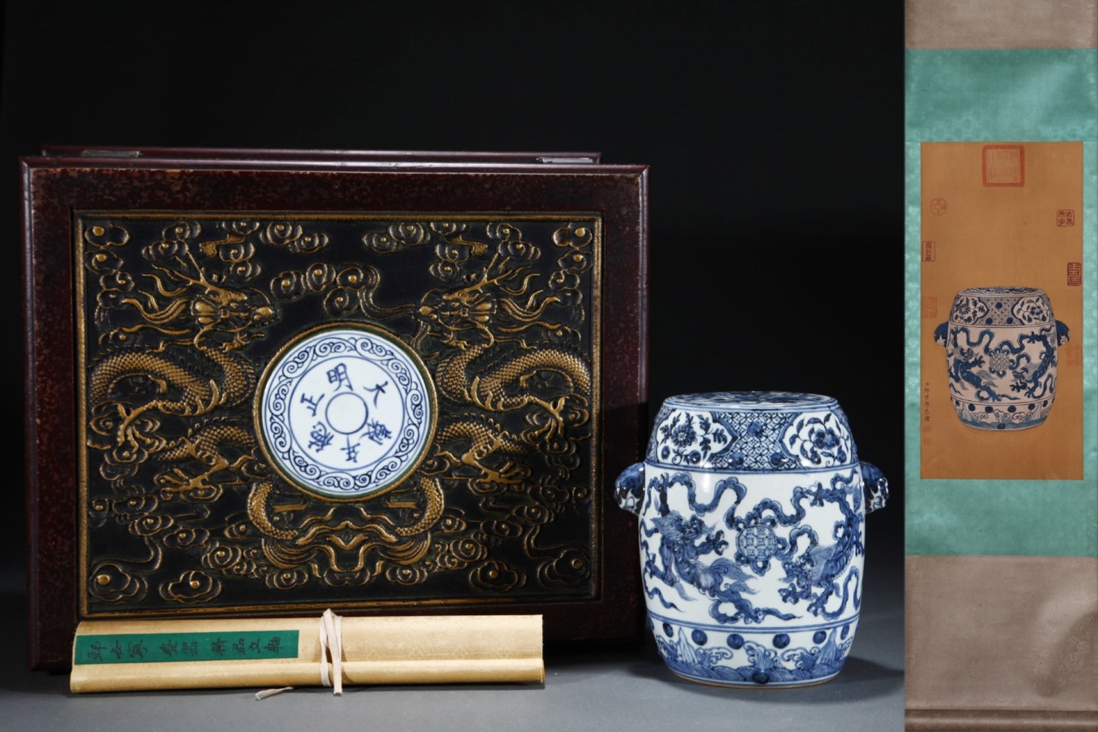An Exquisite Blue and White Lion Pattern Double-Ears Jar with Cover,with Chinese Vertical Scroll Ink: An Exquisite Blue and White Lion Pattern Double-Ears Jar with Cover,with Chinese Vertical Scroll Ink Painting on Silk,Ming Dynasty,China,Zhengde Six-character Mark,Size:(Without