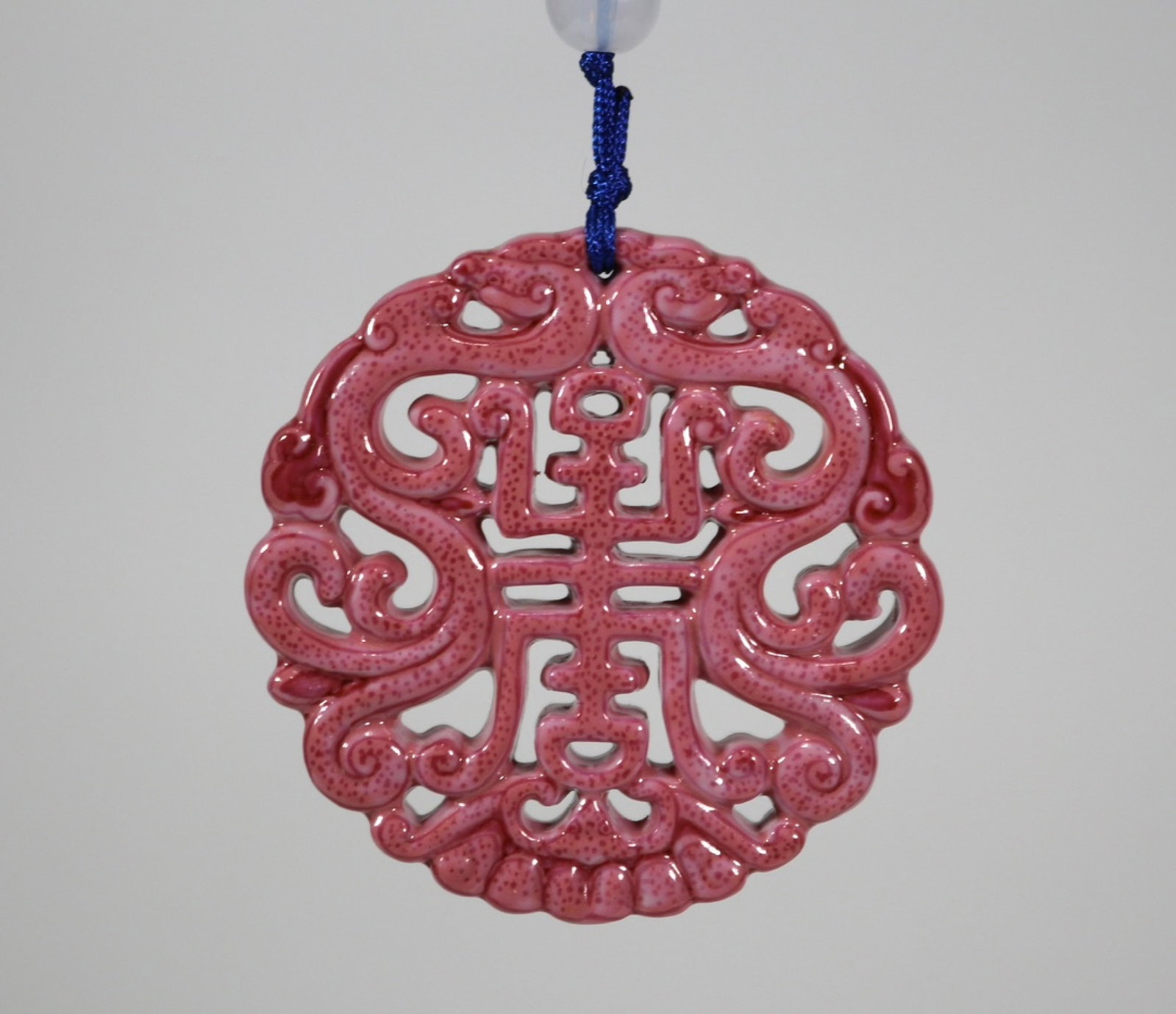 An Exquisite Ruby Red-Glazed Shou-Character Pattern Pendant: An Exquisite Ruby Red-Glazed Shou-Character Pattern Pendant,Qing Dynasty,China,Size:2.3in 胭脂红寿字纹挂件,中国清代