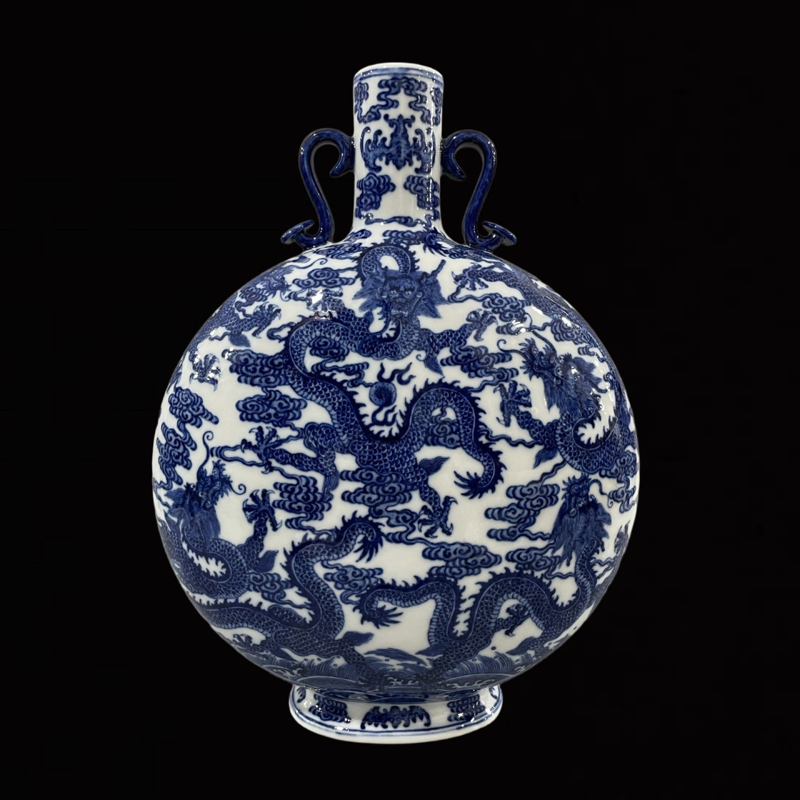 A Rare Blue and White Auspicious Cloud and Dragon Pattern Double-Ears Vase: A Rare Blue and White Auspicious Cloud and Dragon Pattern Double-Ears Vase,Qing Dynasty,China,Qianlong Six-character Mark,Size:13.4inx9.8in