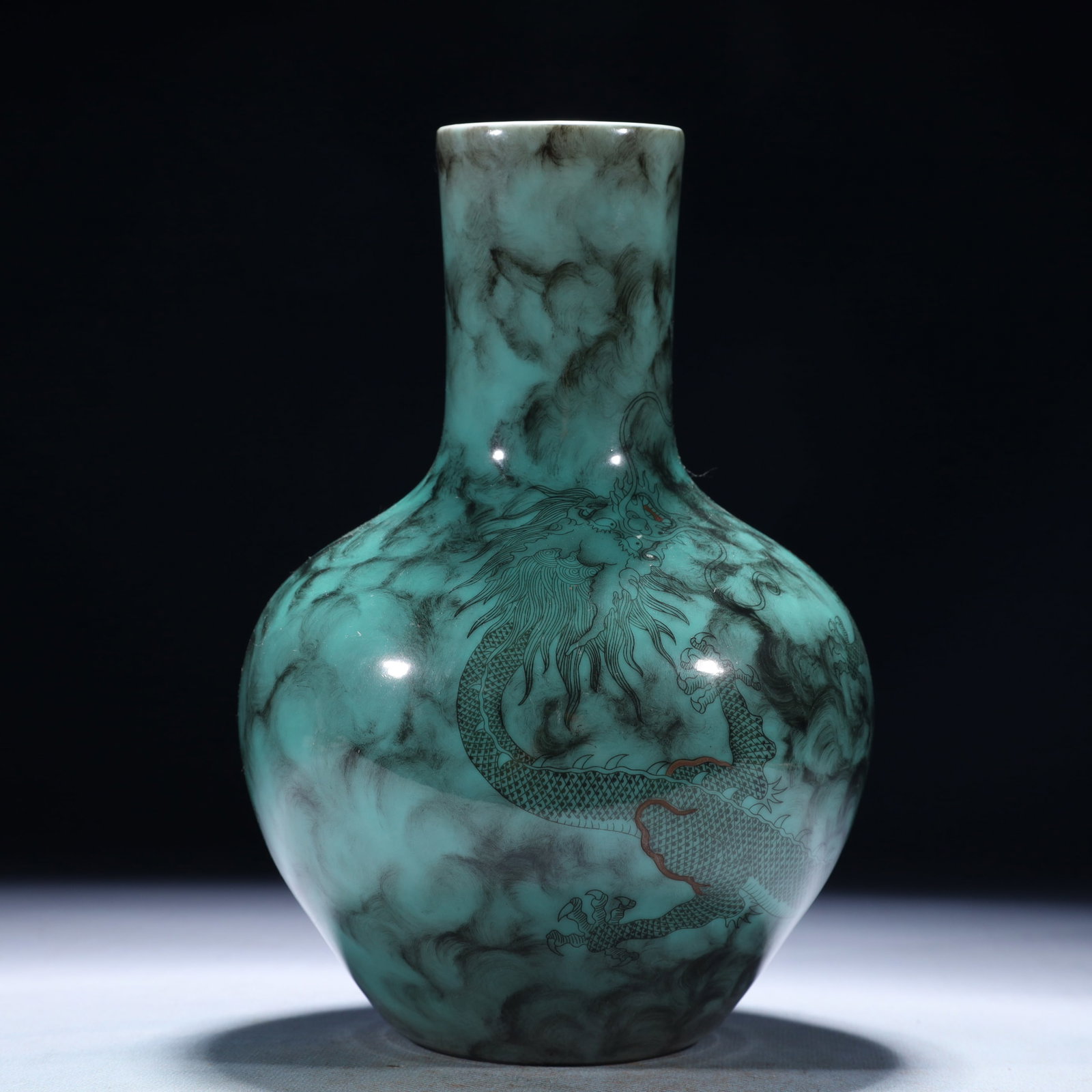 An Exquisite Turquoise Glazed Ink Color Auspicious Cloud and Dragon Pattern Vase: An Exquisite Turquoise Glazed Ink Color Auspicious Cloud and Dragon Pattern Vase,Qing Dynasty,China,Qianlong Six-character Mark,Size:5.5inx8.7in,Weight:950g